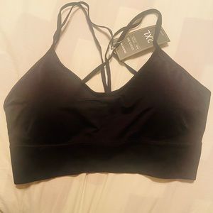 Black sports bra top wireless size 2xl. New with pads, criss cross string back,